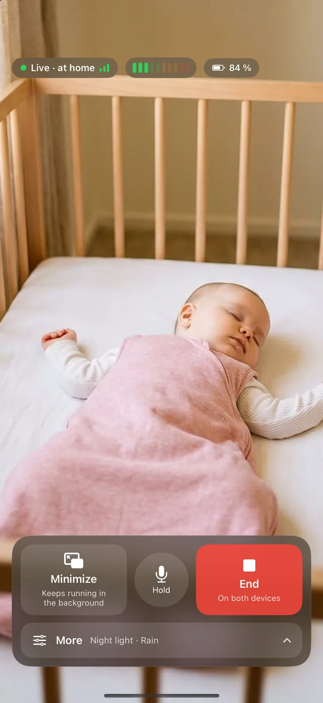 HeyFini parent unit at night: live view of the nursery with sound level, battery status and talk button